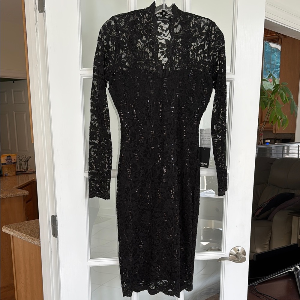 Marina size XS black lace bodycon dress w/sheer long sleeves and bodice. NWT.